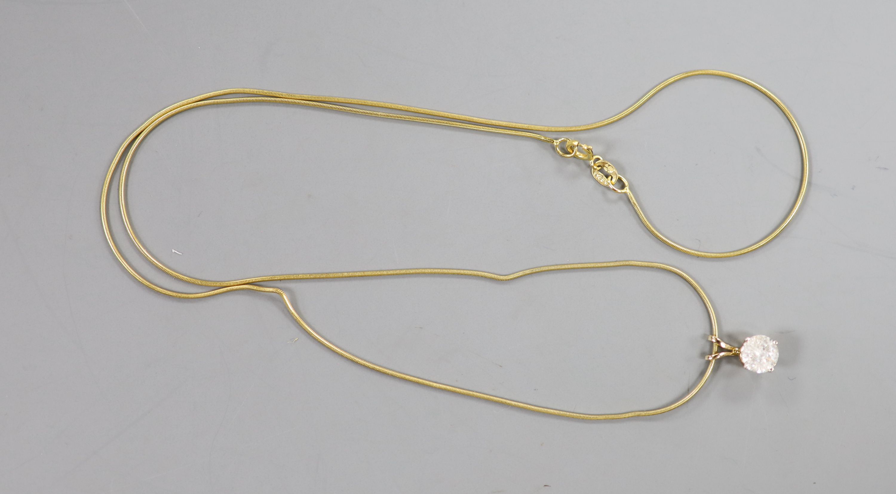 A solitaire diamond pendant on 9ct gold fine chain